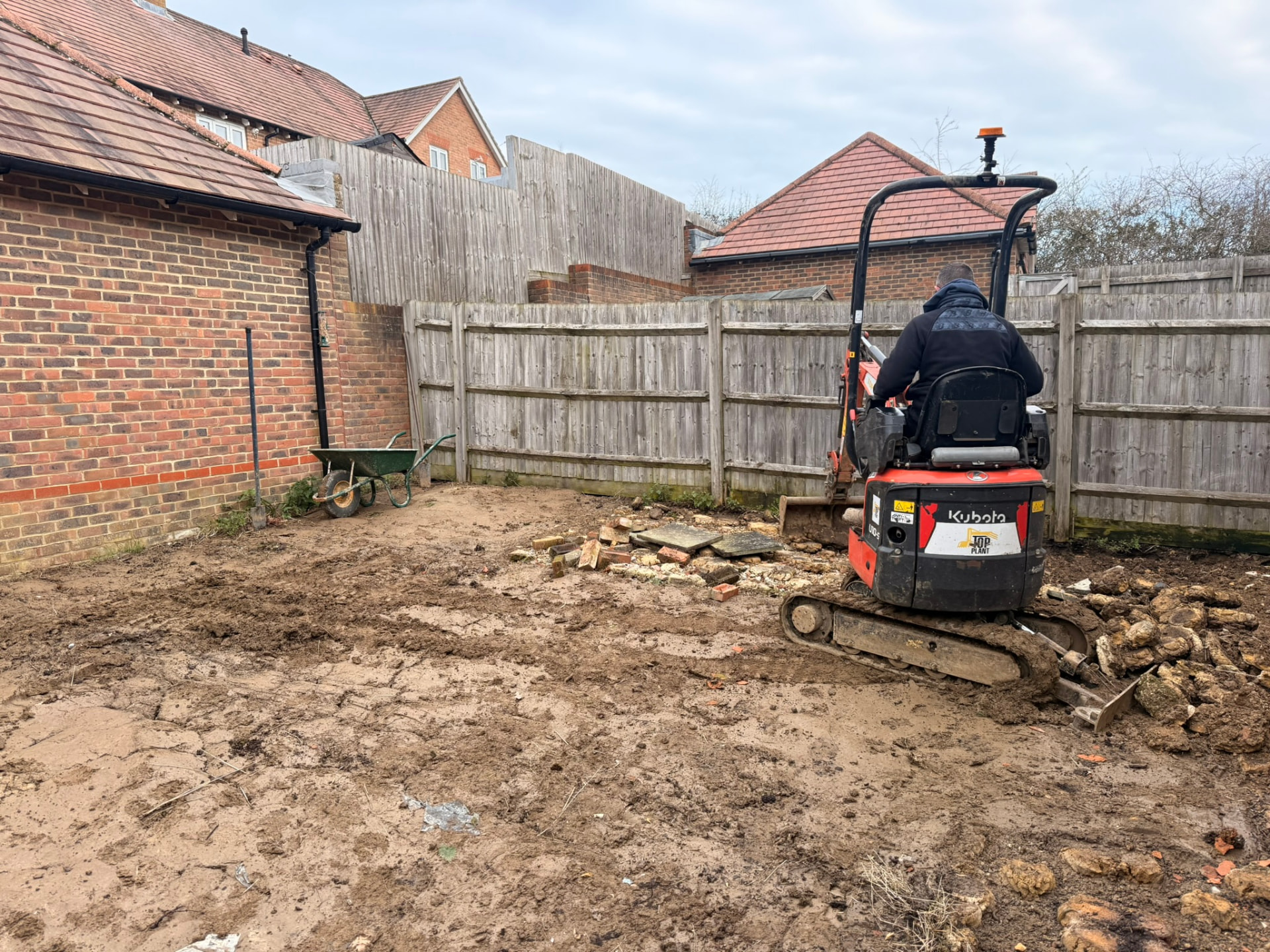 Garden before the project began, with the ground excavated and ready for the new landscaping